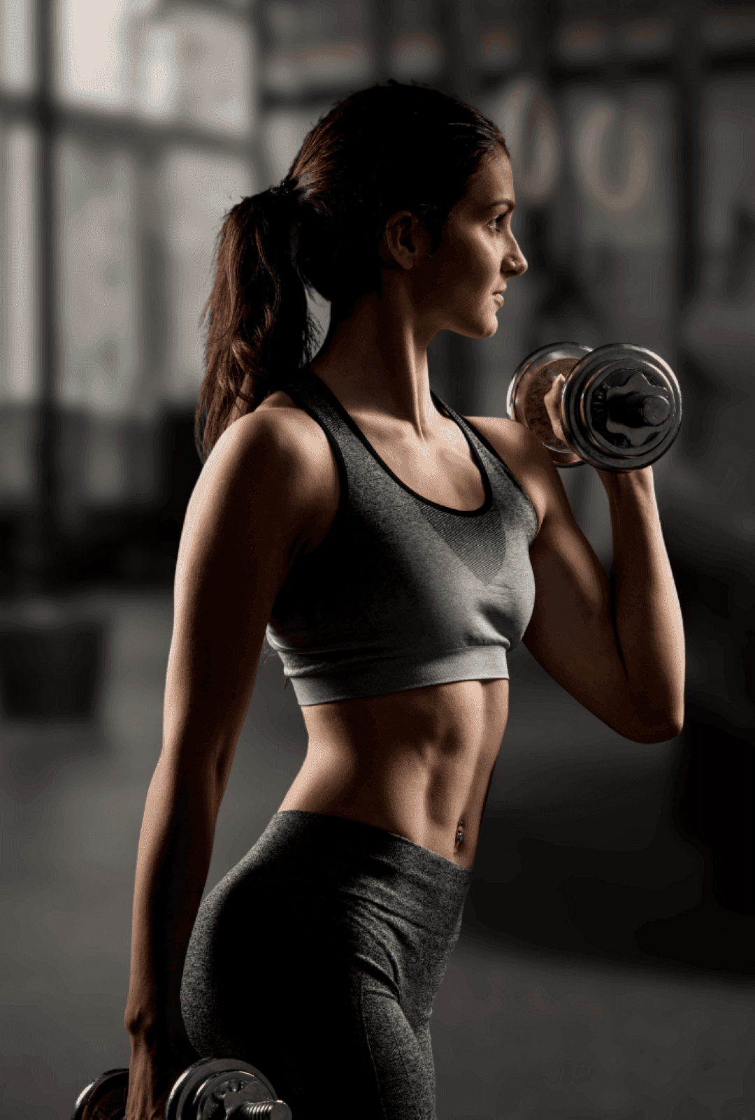 Athlete training with dumbbells